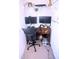Small office features a desk, chair, and ample monitor space for productivity at 1136 Knotty Oaks Dr, Apex, NC 27523