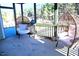 Comfortable screened-in porch featuring egg chairs and nature views at 1136 Knotty Oaks Dr, Apex, NC 27523