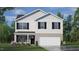 Charming two-story home featuring white siding, brick accents, and a well-manicured lawn at 120 Paper Birch Way, Fuquay Varina, NC 27526