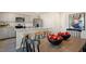 Modern kitchen featuring stainless steel appliances, granite countertops, and a breakfast bar at 120 Paper Birch Way, Fuquay Varina, NC 27526
