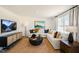 Comfortable living room with sectional sofa, modern decor, and a large TV at 120 Paper Birch Way, Fuquay Varina, NC 27526