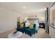 Cozy main bedroom featuring neutral decor, sitting area, and ensuite bathroom at 120 Paper Birch Way, Fuquay Varina, NC 27526