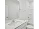 Modern bathroom featuring a large mirror, double sinks, and a shower-tub combo at 121 Willow Cameron Way, Angier, NC 27501