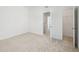 Bright bedroom featuring plush carpeting and a large closet with ample storage space at 121 Willow Cameron Way, Angier, NC 27501