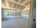 Bedroom under construction with drywall, an angled ceiling, and a window at 121 Willow Cameron Way, Angier, NC 27501