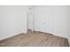 Bright bedroom with wood-look flooring, a closet, and neutral paint at 121 Willow Cameron Way, Angier, NC 27501