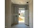 View of an unfinished entryway with a white door opening to the outside at 121 Willow Cameron Way, Angier, NC 27501