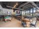 Expansive interior featuring a full bar, exposed ceiling, large screen, and multiple tables and seating areas at 121 Willow Cameron Way, Angier, NC 27501