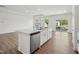 Kitchen island with stainless steel dishwasher and sink, connecting to the living area at 121 Willow Cameron Way, Angier, NC 27501