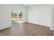 Bright living area with sliding glass doors leading to the outdoors and wood grain flooring at 121 Willow Cameron Way, Angier, NC 27501