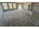 Unfinished living room under construction with large windows, drywall and unfinished floors at 121 Willow Cameron Way, Angier, NC 27501