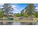 Park scene with playground near a lake and trees with blue skies overhead at 121 Willow Cameron Way, Angier, NC 27501