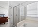 Bathroom featuring a shower and separate tub with window lighting the interior at 1218 Twelve Oaks Ln, Apex, NC 27502