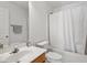 Bathroom features a single sink, toilet, and bathtub with shower curtain at 1218 Twelve Oaks Ln, Apex, NC 27502