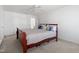 Bright bedroom with a queen-sized bed, ceiling fan, and ample natural light at 1218 Twelve Oaks Ln, Apex, NC 27502