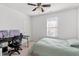 Bedroom features a ceiling fan, computer desk and beige carpet at 1218 Twelve Oaks Ln, Apex, NC 27502
