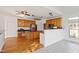 Open kitchen featuring stainless steel appliances, granite counters, and a large island at 1218 Twelve Oaks Ln, Apex, NC 27502