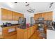 Spacious kitchen features granite island, stainless appliances, and ample cabinet storage at 1218 Twelve Oaks Ln, Apex, NC 27502