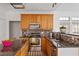 Modern kitchen featuring granite counters, stainless steel appliances, and tiled backsplash at 1218 Twelve Oaks Ln, Apex, NC 27502