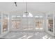 Bright sunroom with lots of natural light and beautiful views through large windows at 1218 Twelve Oaks Ln, Apex, NC 27502