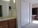 Bathroom features a mirror, sink and vanity with a large closet and bedroom in view at 139 Kingsbury Dr, Chapel Hill, NC 27514