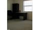 This bedroom has carpeted floors, a window, a desk, a chair, and a bookcase at 139 Kingsbury Dr, Chapel Hill, NC 27514
