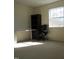 Sunlit bedroom featuring a desk, bookcase, and an ergonomic chair, creating an ideal workspace at 139 Kingsbury Dr, Chapel Hill, NC 27514
