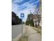 Street view of a bus stop along the sidewalk surrounded by tall trees in the distance at 139 Kingsbury Dr, Chapel Hill, NC 27514