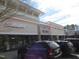 Exterior view of a commercial building with shops and cars parked in front of it at 139 Kingsbury Dr, Chapel Hill, NC 27514