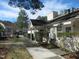 Exterior of community building with laundry services amidst landscaped grounds at 139 Kingsbury Dr, Chapel Hill, NC 27514