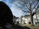 Bright multi-Gathering homes with manicured lawns and white stairs to each unit at 139 Kingsbury Dr, Chapel Hill, NC 27514