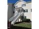 Charming townhouse with a welcoming entrance, complete with a staircase and tidy landscaping at 139 Kingsbury Dr, Chapel Hill, NC 27514