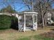 Outdoor view of a white gazebo with bench seating, surrounded by trees and greenery at 139 Kingsbury Dr, Chapel Hill, NC 27514