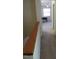 Hallway leads to a room with carpeted floors, a desk, a chair, and a window at 139 Kingsbury Dr, Chapel Hill, NC 27514