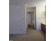 Hallway leading to an additional room with an attached bathroom and bedrooms nearby at 139 Kingsbury Dr, Chapel Hill, NC 27514