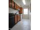 Efficient kitchen space with classic wooden cabinetry, a window, and essential appliances for cooking at 139 Kingsbury Dr, Chapel Hill, NC 27514