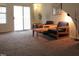 Inviting living area with comfortable seating and a sliding glass door leading to outdoor space at 139 Kingsbury Dr, Chapel Hill, NC 27514