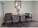 Cozy living area featuring a round table, chairs, and complementary decor under warm lighting at 139 Kingsbury Dr, Chapel Hill, NC 27514