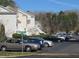 Exterior view of parking area with parking spots available near residential buildings at 139 Kingsbury Dr, Chapel Hill, NC 27514