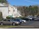 Exterior view of the parking lot with nearby condos and a street sign at 139 Kingsbury Dr, Chapel Hill, NC 27514