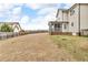 Side view of the backyard featuring a screened porch area, spacious yard, and privacy fence, ideal for outdoor enjoyment at 1426 Phelps Ridge Dr, Fuquay Varina, NC 27526