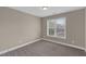Bedroom featuring a window, neutral paint, and carpet flooring at 1426 Phelps Ridge Dr, Fuquay Varina, NC 27526