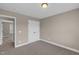 Bedroom with carpet flooring, neutral paint and double closet doors at 1426 Phelps Ridge Dr, Fuquay Varina, NC 27526