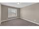 Bedroom featuring a window, neutral paint, and carpet flooring at 1426 Phelps Ridge Dr, Fuquay Varina, NC 27526