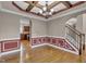 Bright dining room with hardwood floors, chandelier, opening to kitchen and stairway at 1426 Phelps Ridge Dr, Fuquay Varina, NC 27526