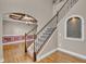 Elegant entryway with staircase featuring hardwood floors and decorative window with decorative ceiling design at 1426 Phelps Ridge Dr, Fuquay Varina, NC 27526