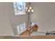 Grand foyer with chandelier, hardwood floors, and staircase at 1426 Phelps Ridge Dr, Fuquay Varina, NC 27526