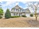 Charming two-story home featuring a manicured lawn and mature landscaping at 1426 Phelps Ridge Dr, Fuquay Varina, NC 27526
