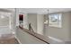 Hallway with chandelier, view to laundry area and staircase at 1426 Phelps Ridge Dr, Fuquay Varina, NC 27526