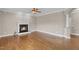 Cozy living room featuring fireplace and hardwood flooring at 1426 Phelps Ridge Dr, Fuquay Varina, NC 27526